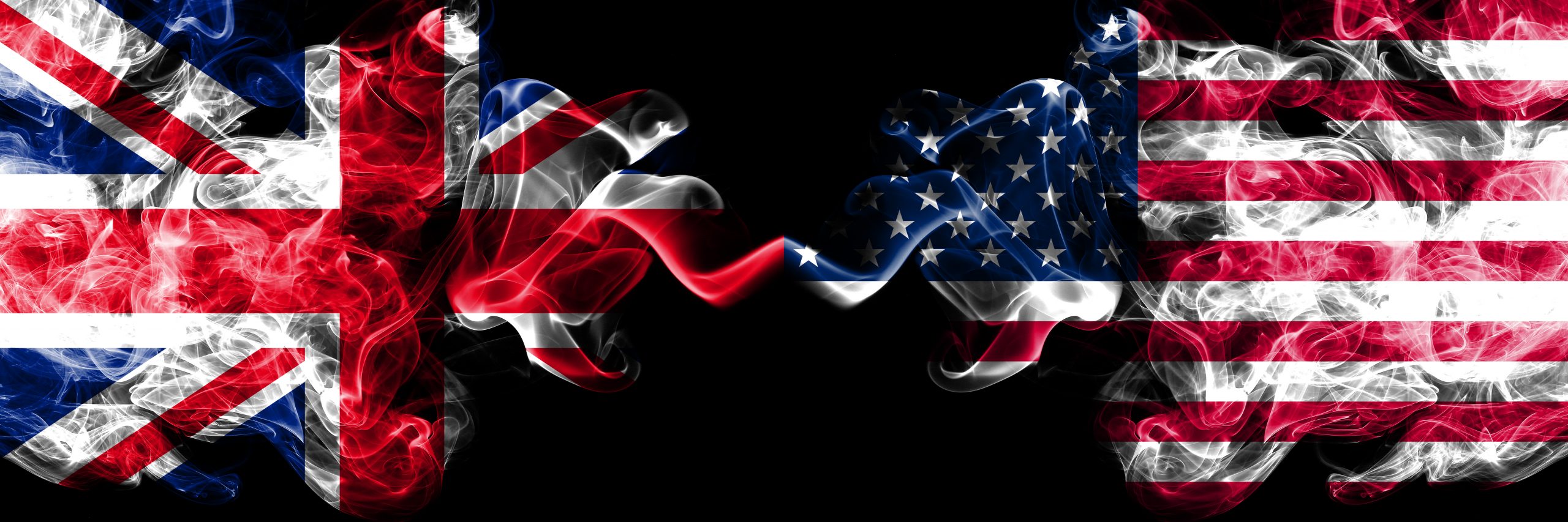 UK and US flags smoke between them