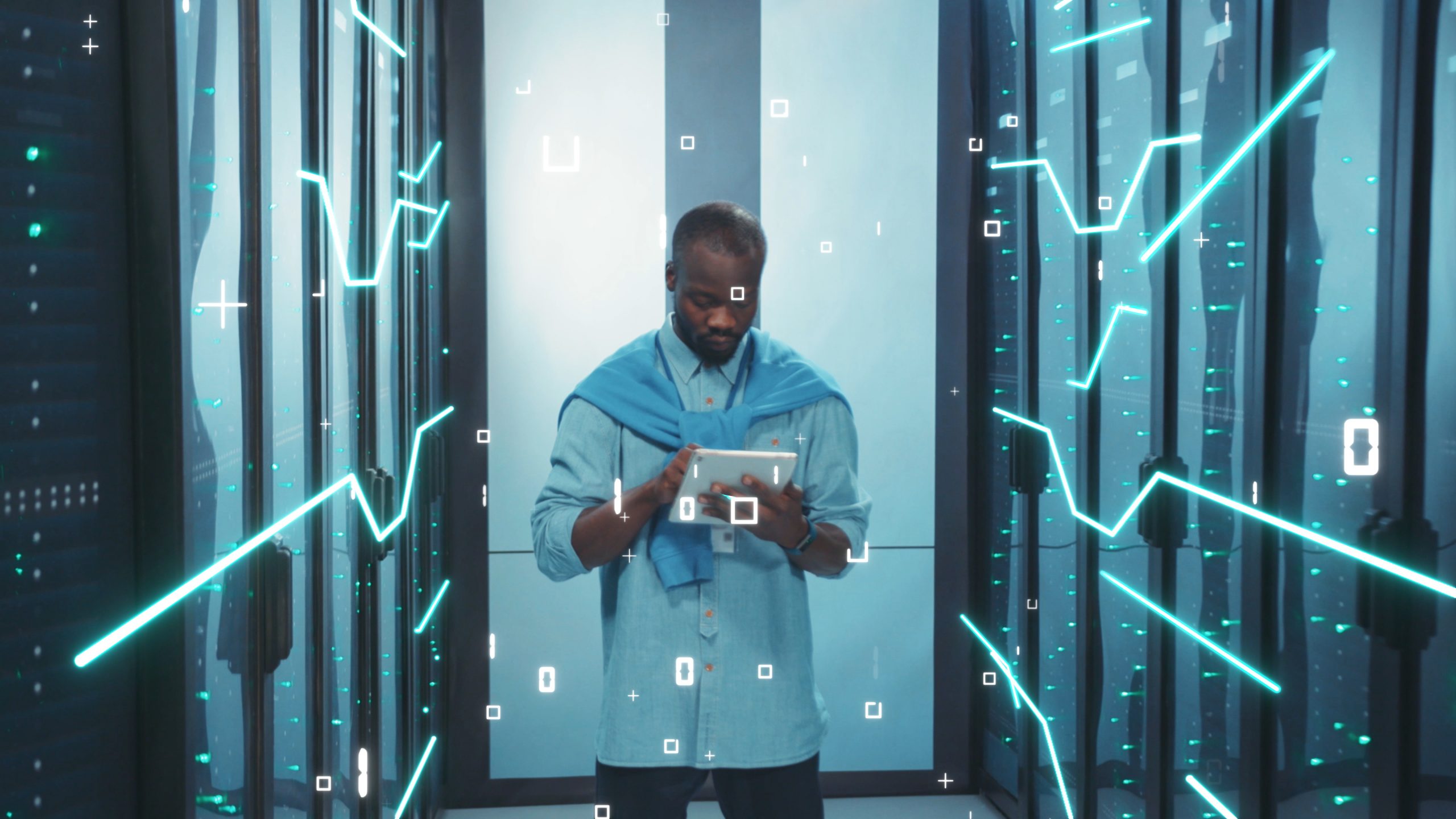 IT Engineer Controlling Server Cabinet with Tablet