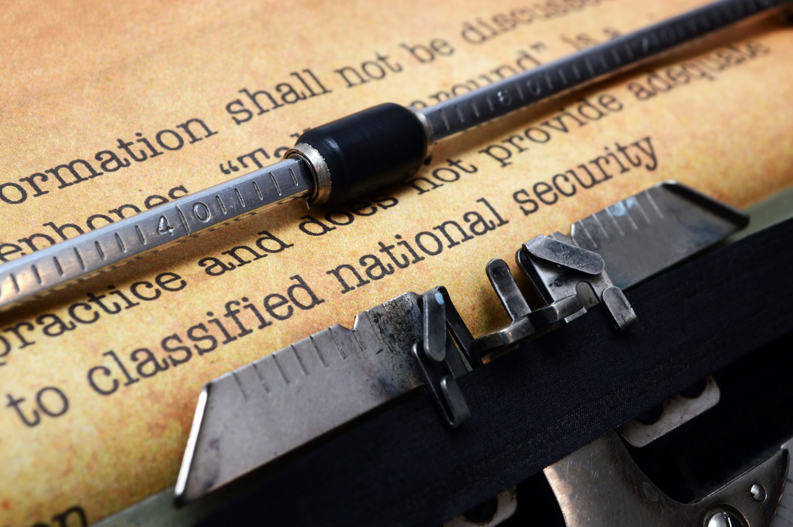 Classified document on typewriter - modern electronic document governance might not use a type written to classify...